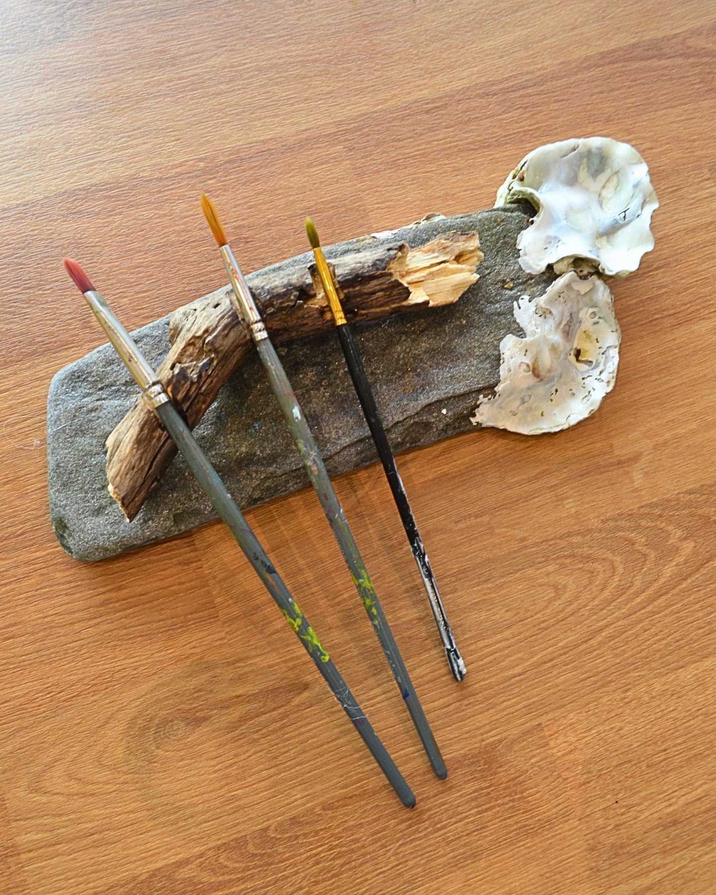 brush rest and mixing palette made from oysters, slate rock and driftwood