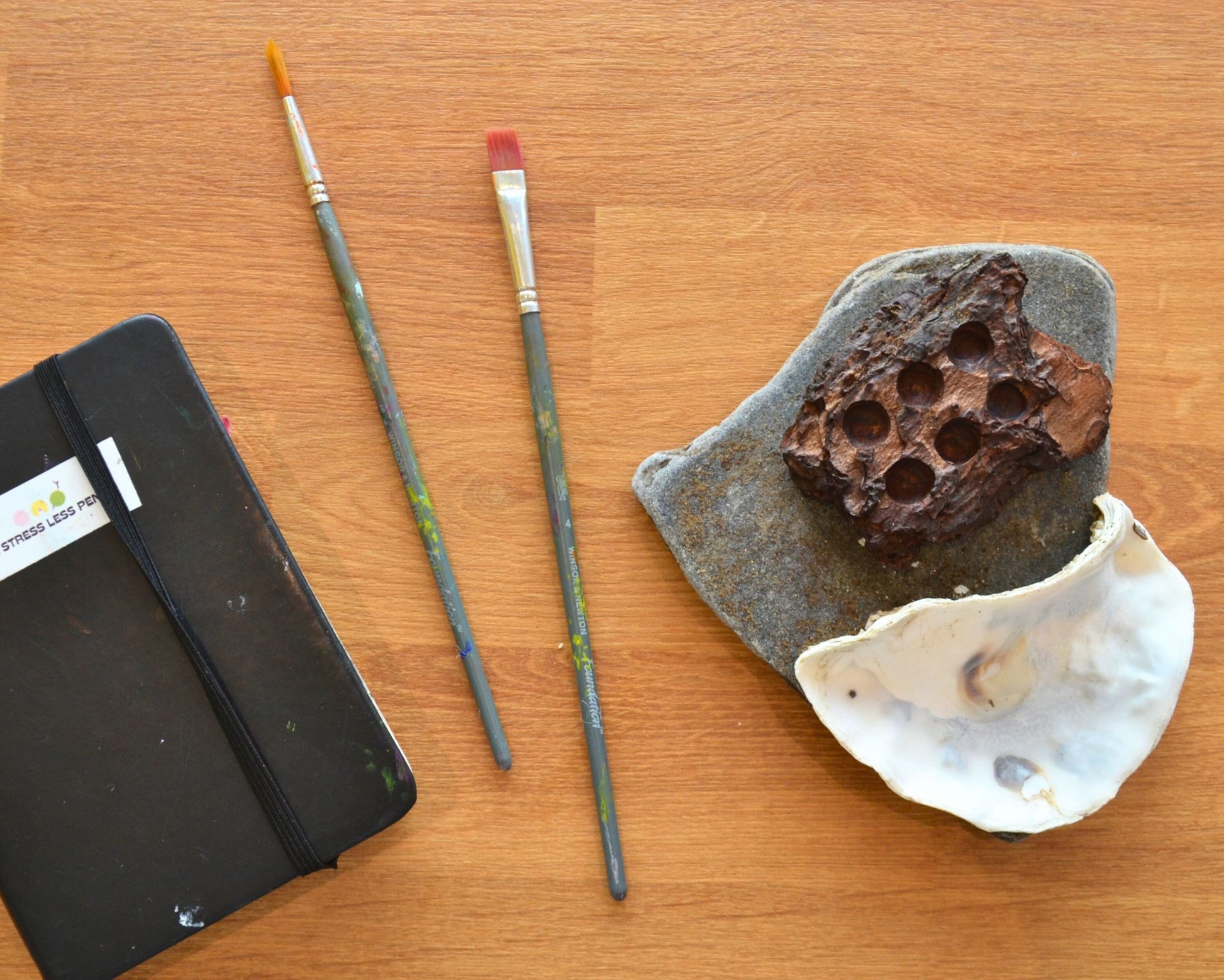 watercolour palette made from oyster shell, wood, and slate